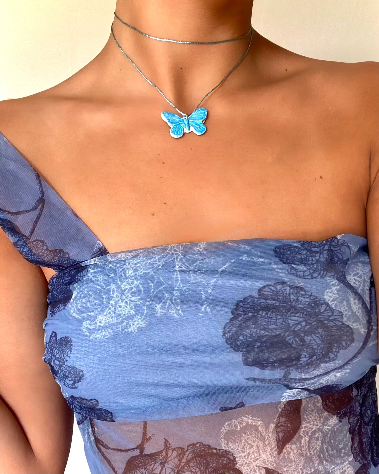 Collier papillon bleu