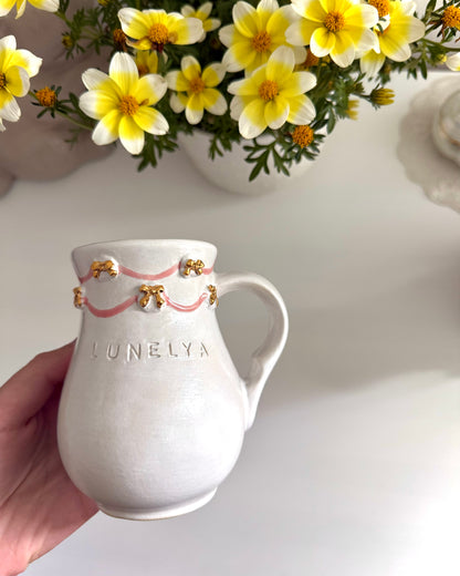 Pichet noeuds or ruban rose